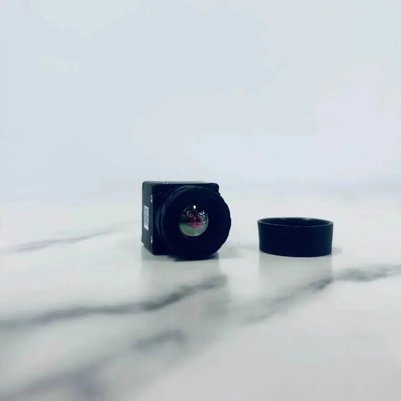 Front view of the MINI PRO lens and lens cap